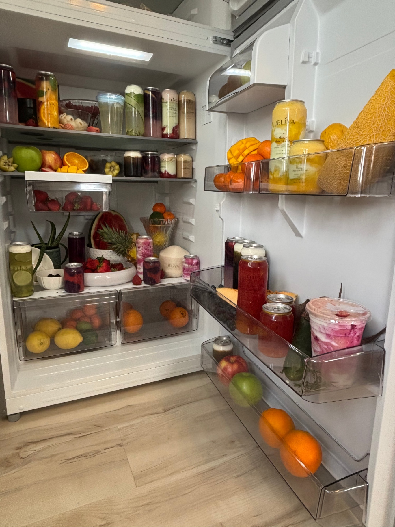Fridge full of Jeliva drinks and fruit